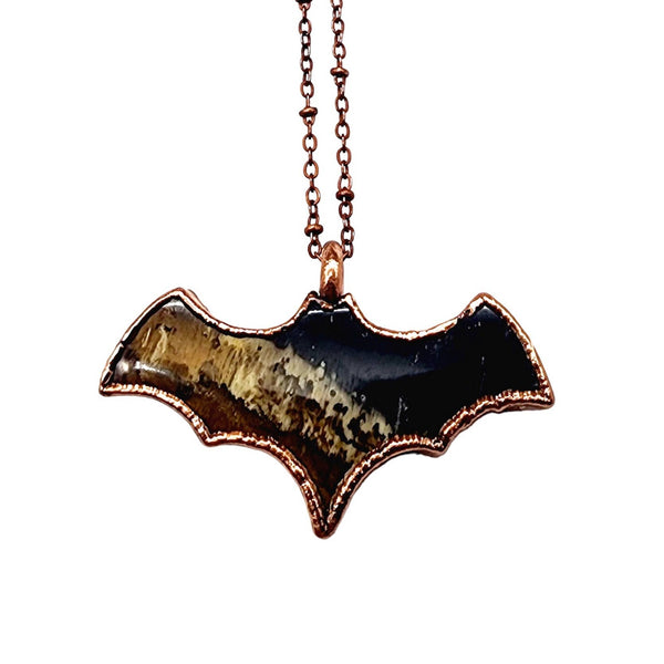 Fossilized Palm Wood Bat Necklace